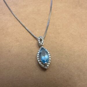 Beautiful Sterling silver necklace with a Blue Topaz pendant.
